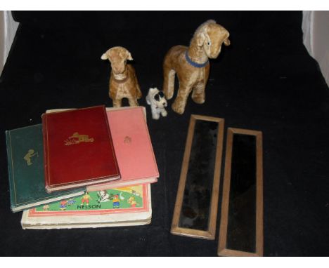 Two hand painted magic lantern slides, two wood wool filled velvet covered toy giraffes, a small toy terrier, one volume Nels