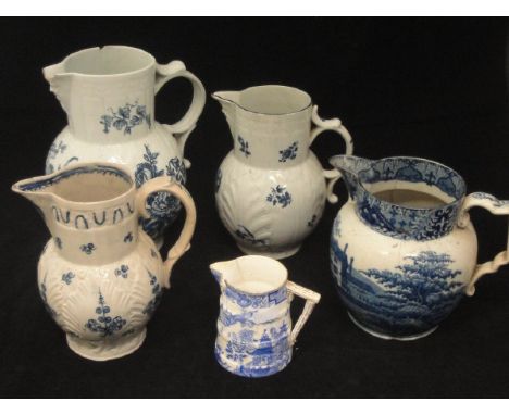 An 18th Century Worcester "Cabbage Leaf" jug with Bacchus mask spout, two similar jugs, an early 19th Century blue and white 