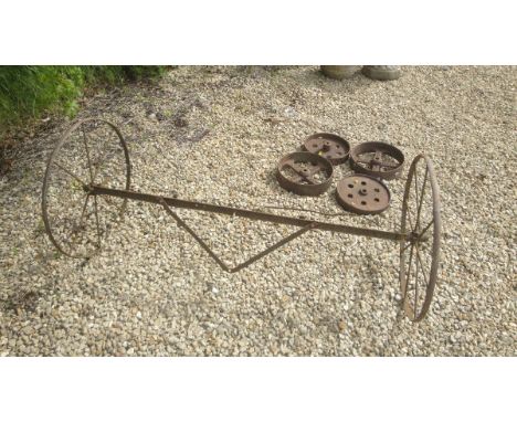 A pair of vintage cart wheels together with a pair of Williams & Son hay wheels bearing inscription together with another sim