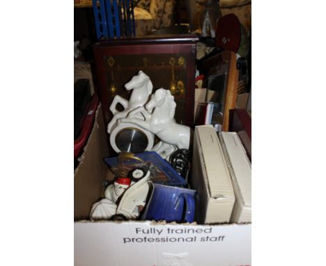 A box of various ornamental wares "Prancing Horses" clock, souvenir spoons, wall mounted barometer, other china wares, etc