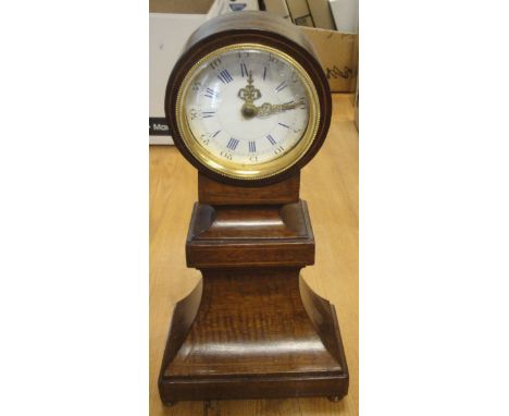 A mahogany cased mantel clock with blue Roman numerals to the enamelled dial, together with two further mantel clocks
