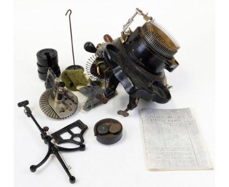 A 19thC Imperia Knitting Machine, of circular form in a metal casing with paperwork and additional pieces, with differing man