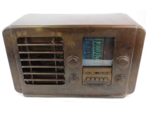 A vintage Echo Ekco type A23 receiver Bakelite case radio, of shaped form, with front tuning knops and grill speaker, 56cm wi