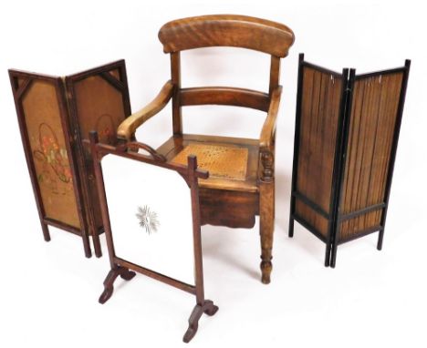 An early 20thC commode chair, with shaped cresting rail, horizontal back splat and bergere style seat on turned front legs, 9