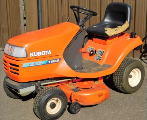 A Kubota Anti Scalp T1560 auto throttle ride-on lawn mower, in orange, with manual, 115cm high.