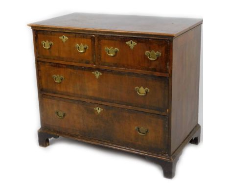 An 18thC walnut chest, of two short and two long drawers, each with a wide crossbanding, on bracket feet, partially inlaid to