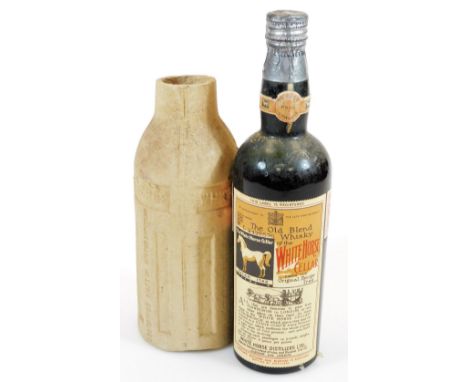 A bottle of 1938 Old Blend White Horse Cellar scotch whisky, with outer White Horse cover, 30cm high.