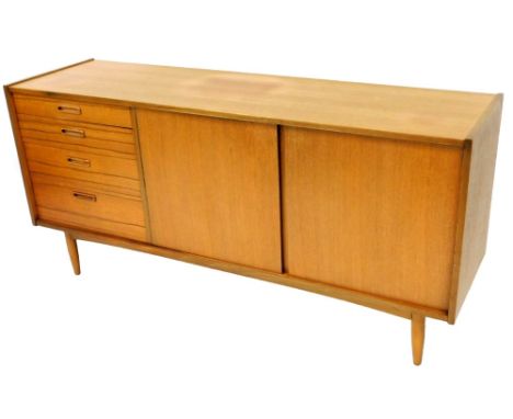An L Marcus Butilux vintage teak sideboard, of rectangular form set with an arrangement of four graduated drawers and double 