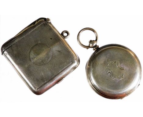 An early 20thC pocket watch case, engine turned with a vacant shield cartouche and plain ring top, 7cm high, marked 0.935, a 