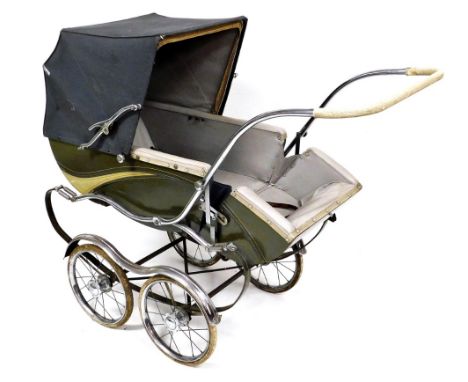 A vintage Montford pram, with adjustable canopy in light blue and a green and cream metal base with four two sized wheels, wi