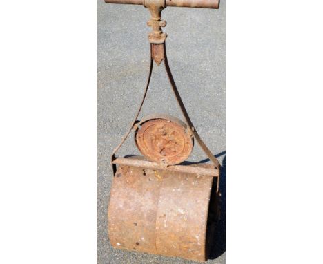A late 19thC heavy garden roller, with turned handle and shaped centre section, 106cm high.