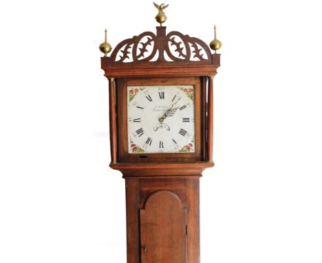 J Bright Saxmundham. A 19thC oak country longcase clock, the shaped cornice surmounted by a brass orb and eagle finial flanke