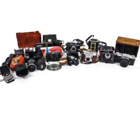 Various cameras, a Voightlander Veitob, 13cm high, in brown leather case, a Paxette 35 auto in fitted case, Beirette BL boots