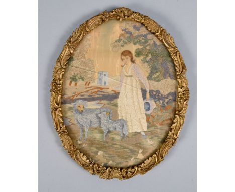 A late Georgian silkwork and painted panel of a shepherdess together with ewe and lamb, oval framed and glazed, 9.5in x 7in.