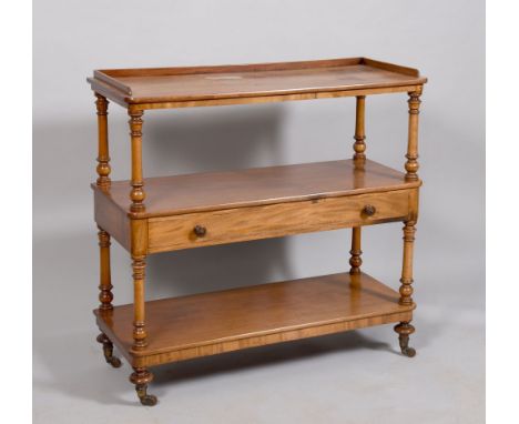 A Victorian mahogany two tier buffet, the upper table with a three quarter short gallery, the central shelf with fitted drawe