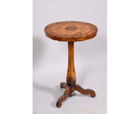 A Victorian walnut veneered circular pedestal tripod table, the top with a wide cross band inlaid with flowers and scrollwork