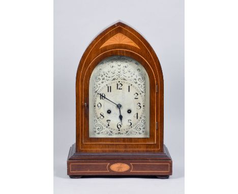 A late 19c German mantel clock with two train movement striking the hours and halves on a gong.  The round topped dial is sil