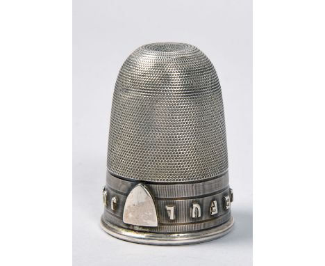 A late Victorian silver thimble tot measure, engine turned and case in relief, 'Just a Thimble Full', Birmingham 1876, makers