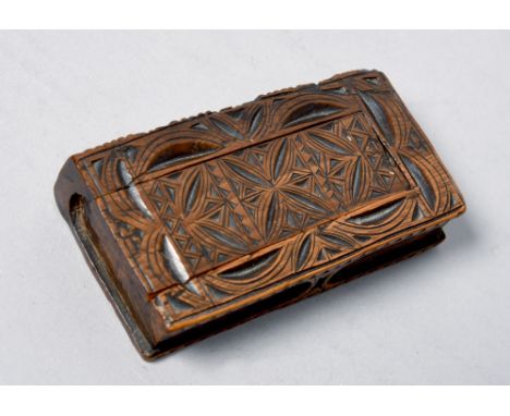 A 19c carved walnut snuff box in the form of a locked book, 3.25in l.