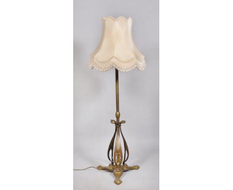 An Art Nouveau brass adjustable height lamp stand of stylistic leaf and flower design converted to electrolier, 47in h.