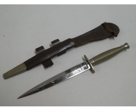 A good quality Commando dagger by Wilkinson Sword Ltd. of London with nickel-plated hilt in leather sheath