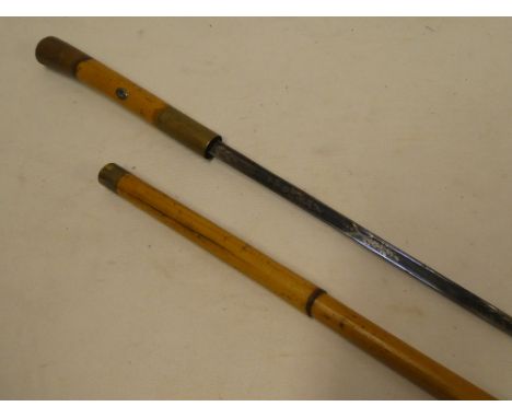 A gentleman's 19th century sword stick with 26" single edged blue and gilt blade in brass mounted bamboo mounts