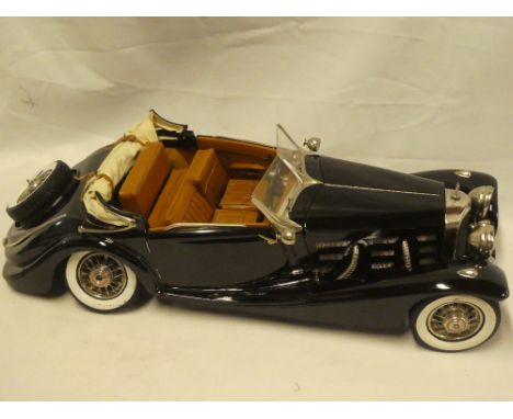 A large scale model of a 1920's/30's Mercedes open sports car, 24" long in perspex display case