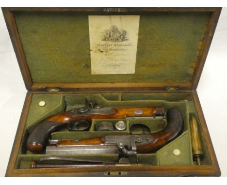 A fine pair of 19th century cased percussion belt pistols by Westley Richards of London with 6" octagonal Damascus barrels en