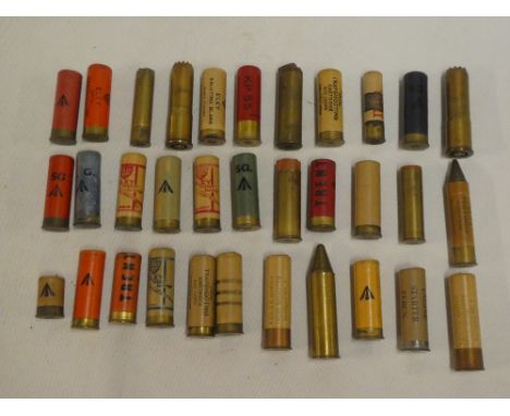 A selection of vintage shotgun cartridges and cases including Wesley Richards Explora 12 bore brass case cartridge, Eley 12 b