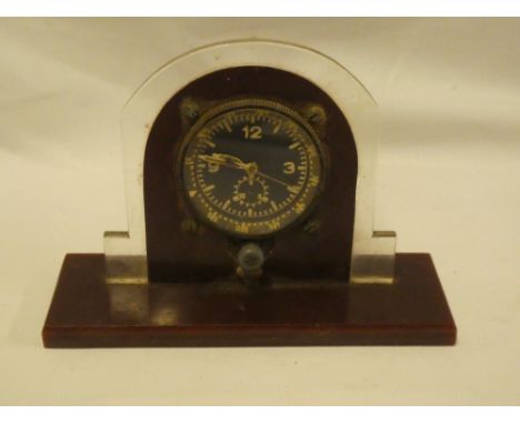 An old instrument dial clock, possibly from an aircraft