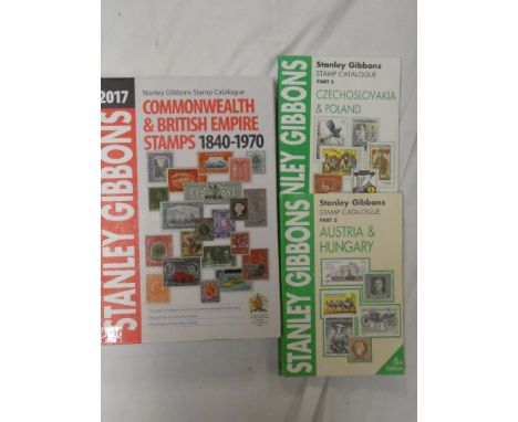 A Stanley Gibbons Commonwealth and British Empire stamp catalogue 2017 and two others 