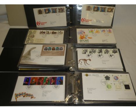 Four albums containing a collection of approximately 180 GB first day covers including 1940 Olympic Games, Wembley 1966 Footb