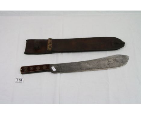 A Military Issued Machete Complete With Scabbard Marked And Dated To The Belt Loop B.H.G. 1943.