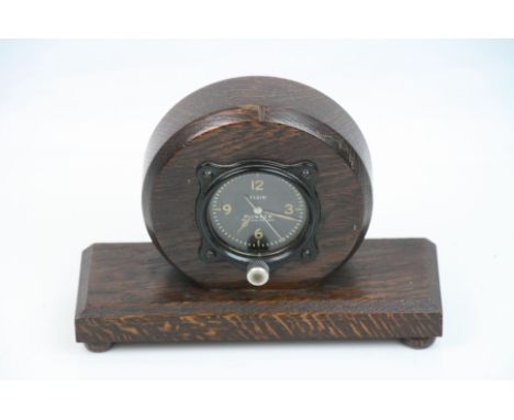 A Vintage World War Two Era American Elgin Pioneer Aircraft Clock Mounted In A Wooden Case.
