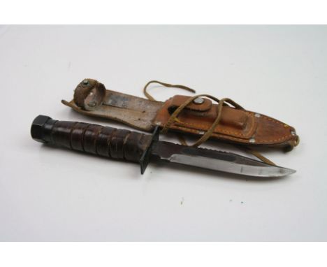 A Vintage United States Marine Corps Fighting Knife With Scabbard.