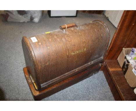 A CASED VINTAGE SEWING MACHINE
