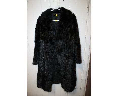 A VINTAGE BLACK FUR COAT 