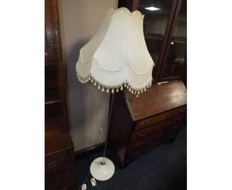 A STANDING LAMP WITH CERAMIC BASE