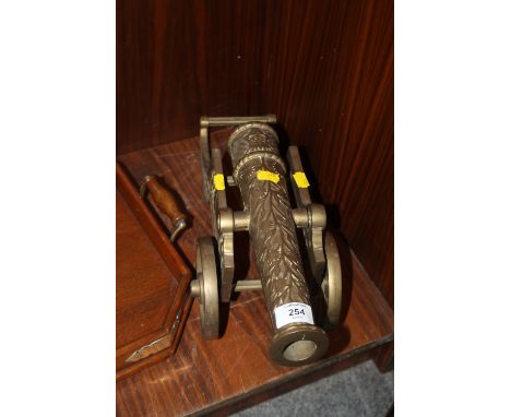 A VINTAGE BRASS ORNAMENTAL CANNON 