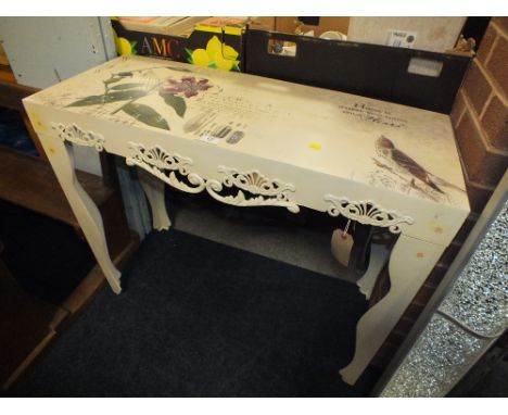 A  FLORAL METAL CONSOLE TABLE