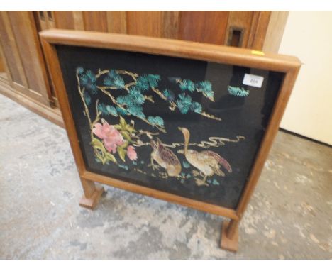 A NEEDLEWORK GLAZED FIRE SCREEN
