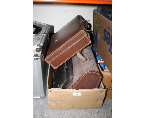 TWO VINTAGE SETS OF LAWN BOWLS, TOGETHER WITH A SMALL VINTAGE SUIT CASE