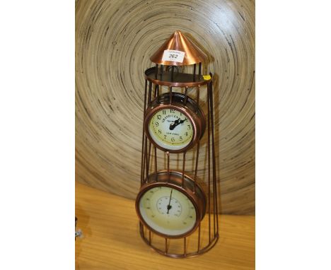 A COPPER EFFECT METAL TOWER CLOCK/THERMOMETER