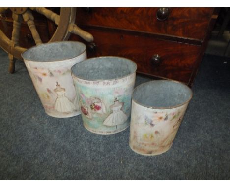 A SET OF THREE MANNEQUIN TIN PAILS