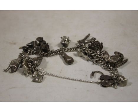 A VINTAGE SILVER CHARM BRACELET