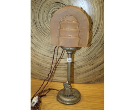 AN ART DECO LAMP WITH FIGURE TO BASE AND PINK GLASS SHADE