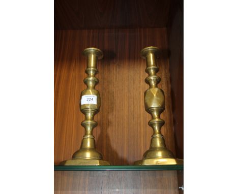 A PAIR OF VINTAGE QUEEN OF DIAMONDS BRASS CANDLE STICKS