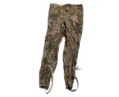 A Pair of Second World War German Waffen-SS Camouflage Trousers, in spotted pattern herringbone twill material, with buttoned