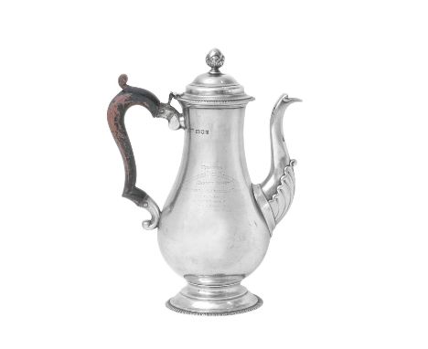 A George V Silver Coffee-Pot, by Carrington and Co., London, 1919 in the George III style, pear-shaped and on spreading foot 