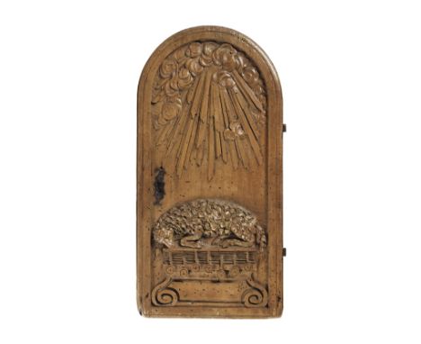 A carved walnut art reliefLate 17th / early 18th centuryDepicting the Holy Lamb, originally a door from a table cabinet, the 